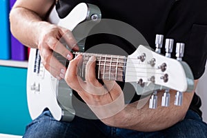 Man playing guitar his favourite song