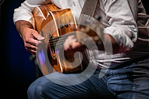 Man playing a guitar on stage