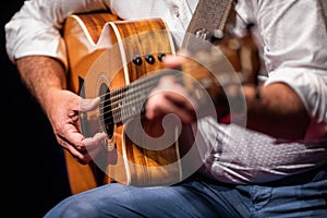 Man playing a guitar on stage