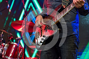 Man playing guitar on a stage musical concert.