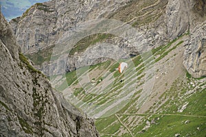 Man playing hang gliding over Mount Pilatus