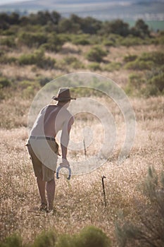 Man Playing Horseshoes