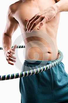 Man playing hula hoop