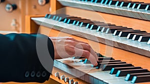 Man Playing On The Keyboard Of An Organ