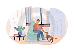 Man playing with lovely dog sitting on armchair at cozy home. Love friendship between puppy and men