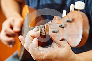 Man playing the mandolin. hands closeup