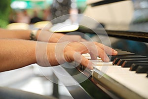 Man playing melody on piano