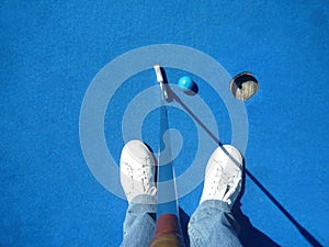 Man playing mini golf with copy space for your text