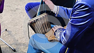 Man playing national instrument at festival in Kazakhstan