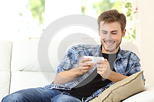 Man playing online games at home