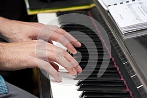 Man playing the piano, keyboard, composing, home recording / studio concept