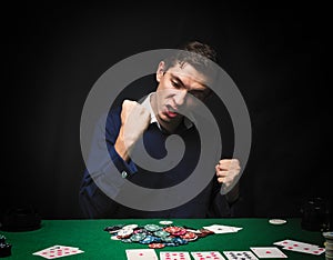 Man is playing poker. Emotional card player win in game, man ve