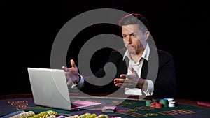 Man playing poker online and loses. Close up