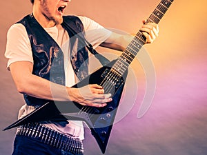 Man playing rock on electric guitar