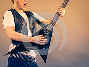 Man playing rock on electric guitar