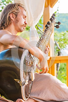 Man playing on sitar