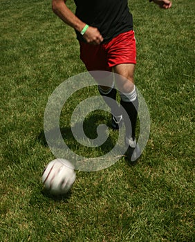 Man playing soccer juggling ball