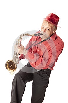 Man playing tenor saxophone playfull