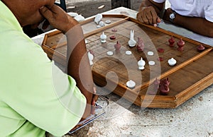 2 Man playing Thai chess on the table