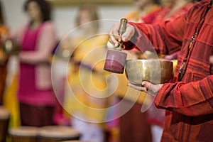 Man playing on a tibetian singing bowl