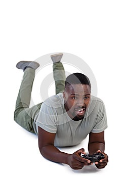 Man playing video game against white background