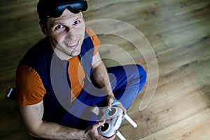 Man Playing Video Games Virtual Reality Glasses In His Apartment.