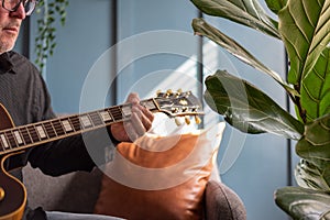 Man playing a vintage guitar