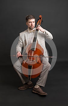 Man playing the viola da gamba photo