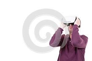 Man playing in virtual reality goggles in white background with copy space