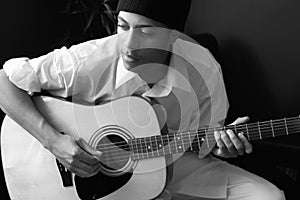 Man Plays Acoustic Guitar photo