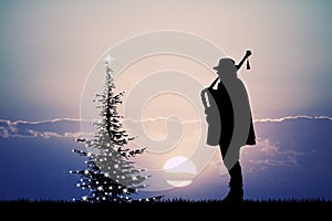 Man plays the bagpipes at Christmas