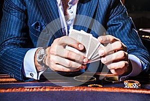 Man plays cards in casino