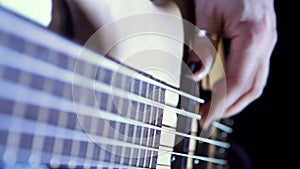 A man plays electic gitar