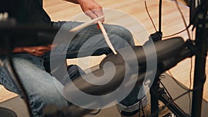 A man plays electronic drums. Close up. Rock music.