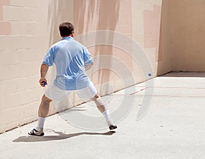 Man Plays Racquetball