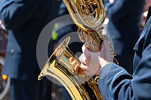 A man plays the saxophone, close-up