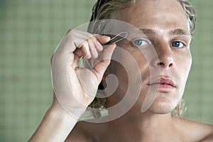 Man Plucking Eyebrows