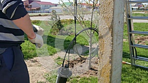 Man plugging in a fiber optic hub cable