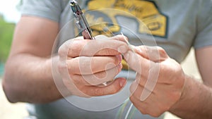 Man plugging in a fiber optic hub cable