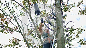 Man plugging in a fiber optic hub cable