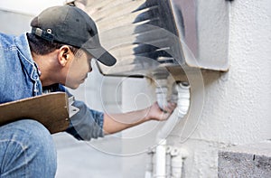 Man, plumber and check faucet pipes for building maintenance, renovation and builder service. Handyman, pipeline and