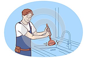 Man plumber is dressed in overalls uses plunger to clear blockage in sink in kitchen or bathroom