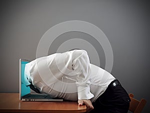 Man plunging into computer