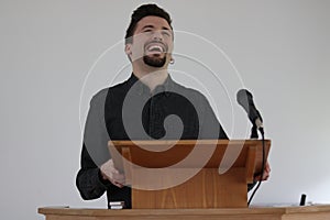 Man on a Podium Laughing