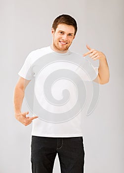 Man pointing at blank white t-shir