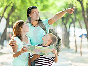 Man pointing the direction for family