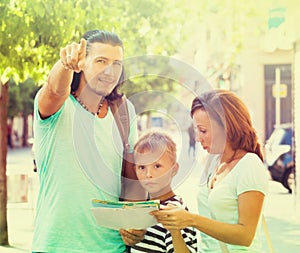 Man pointing the direction for family