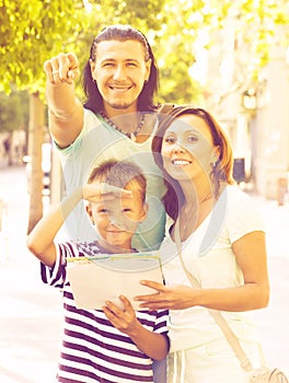 Man pointing the direction for family