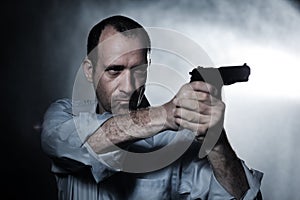 Man pointing gun