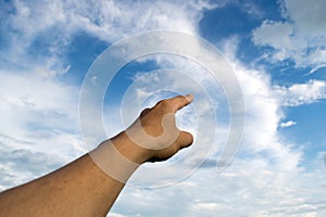 Man pointing his hand and cloud sky background